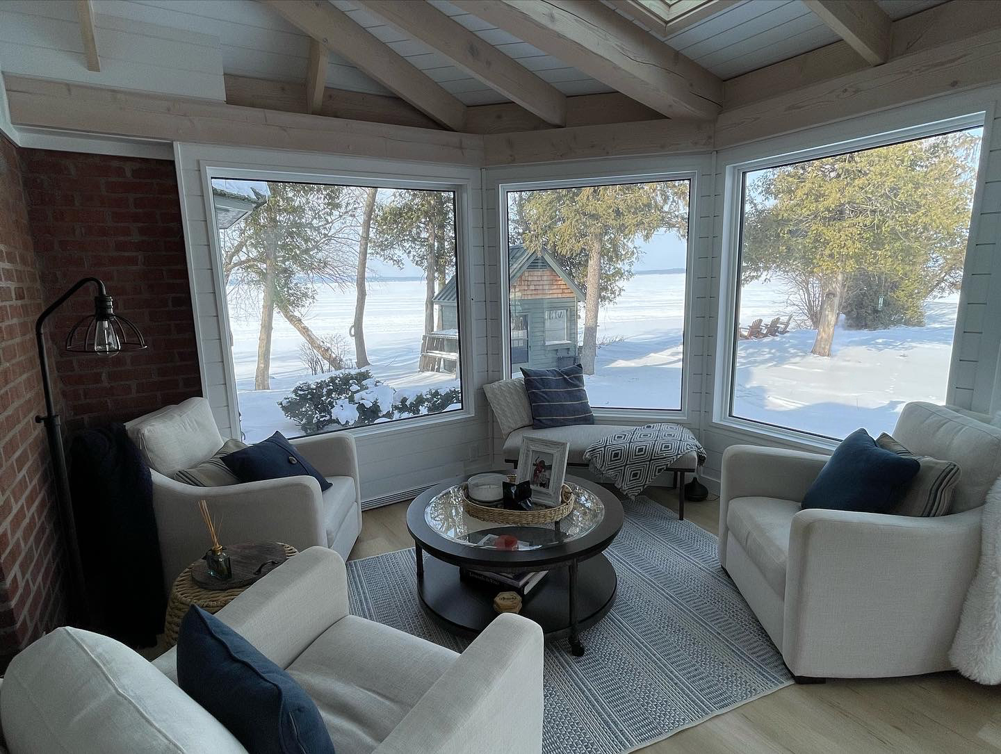 Cozy four-season sunroom with snow outside