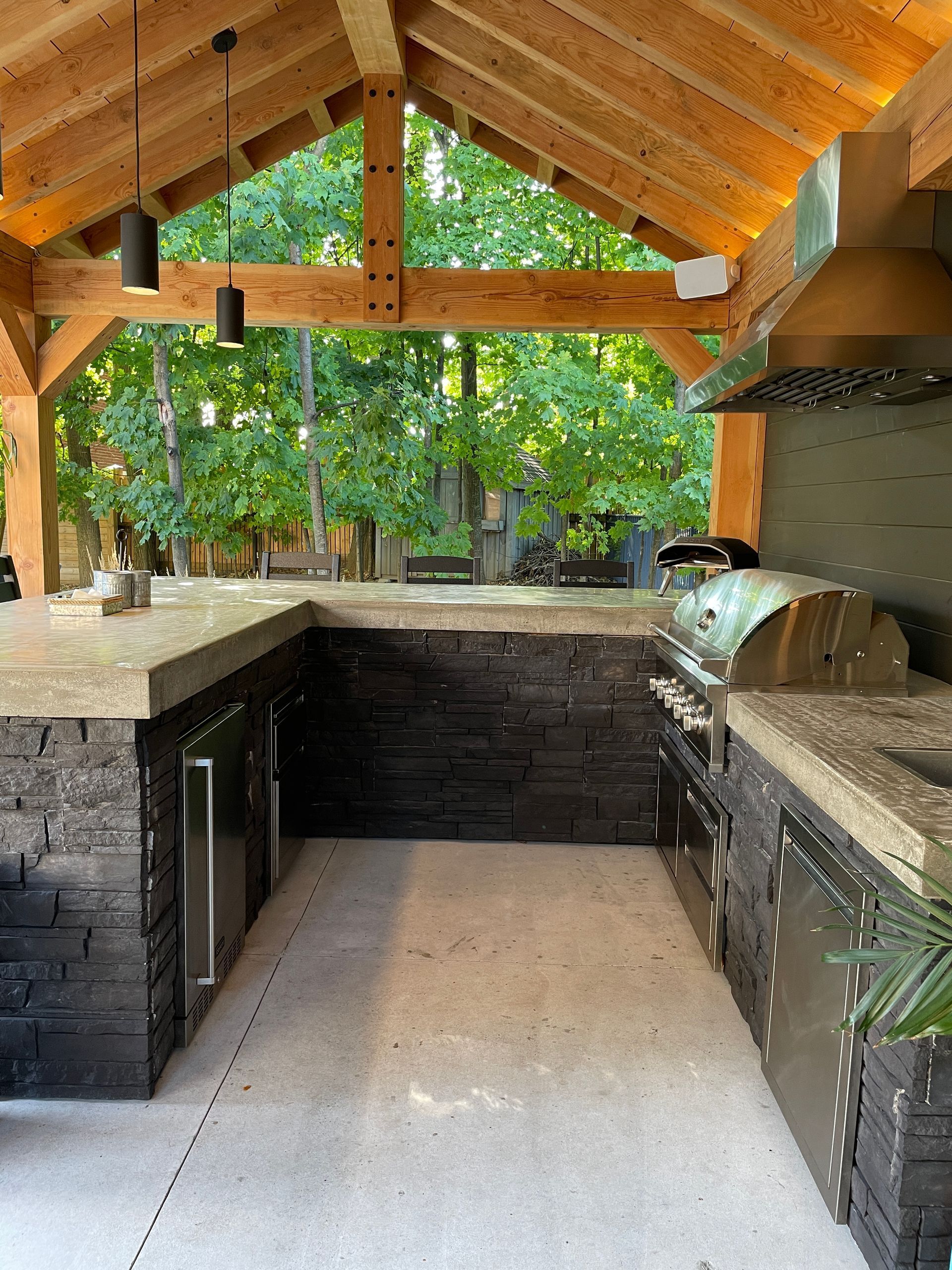 Outdoor kitchen with stone facade