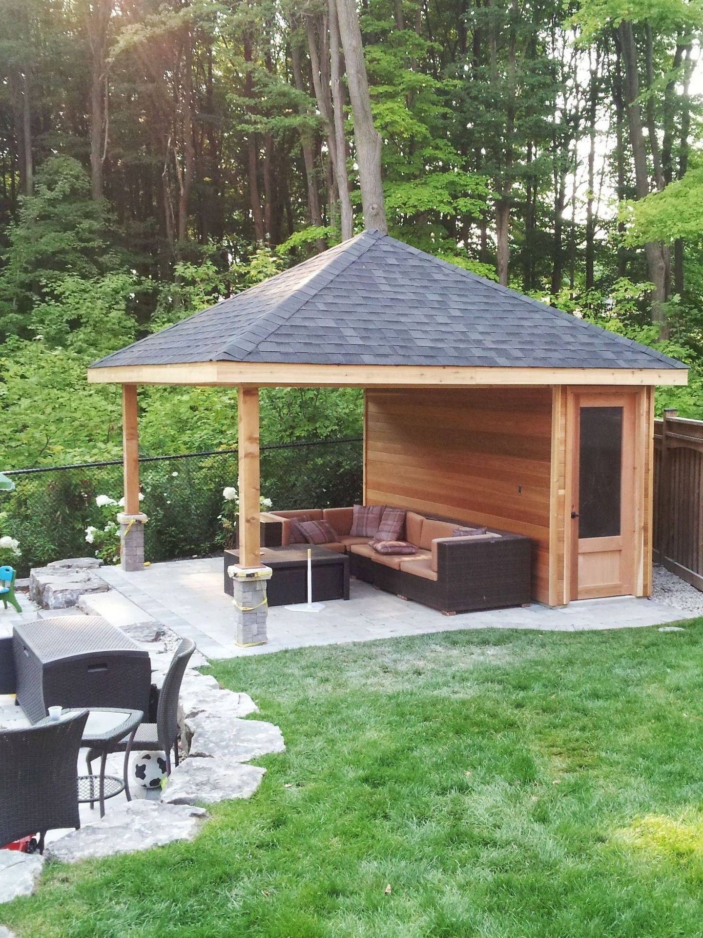 Outdoor lounge with sectional under a gazebo