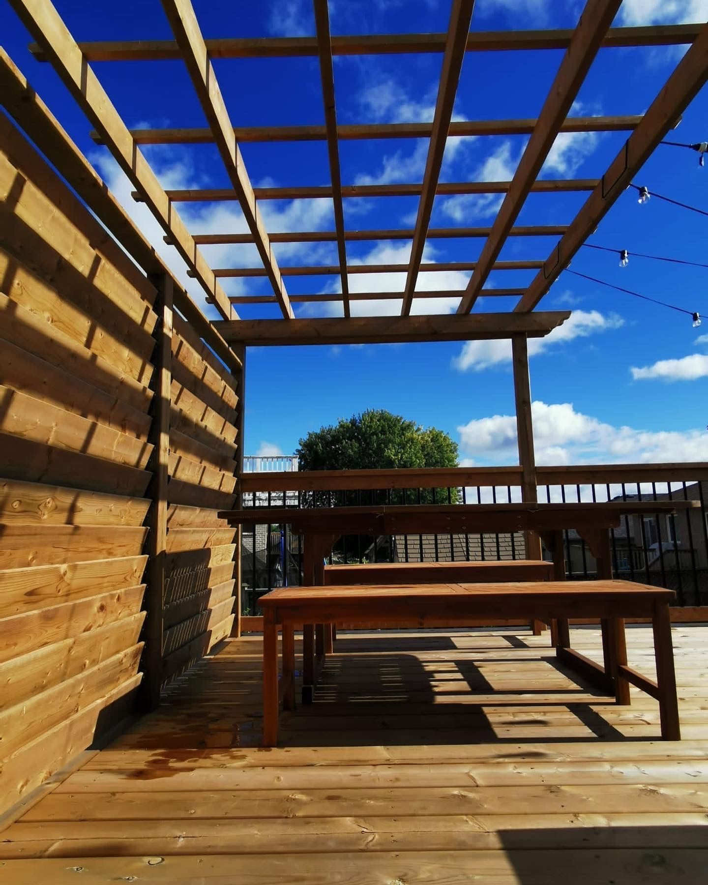 Pergola over a wooden deck
